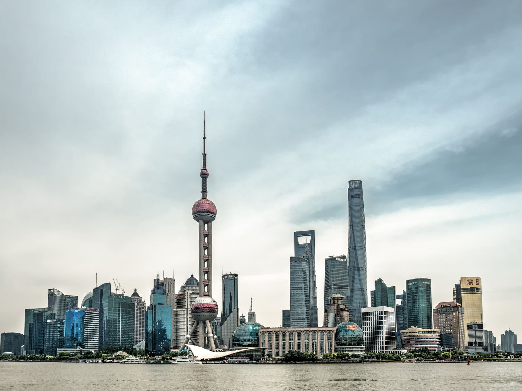 The Pudong skyline in Shanghai with the Oriental Pearl Tower and other skyscrapers along the Huangpu river waterfront